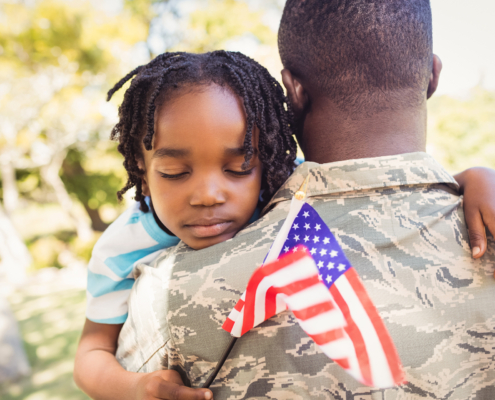 American Veteran and child