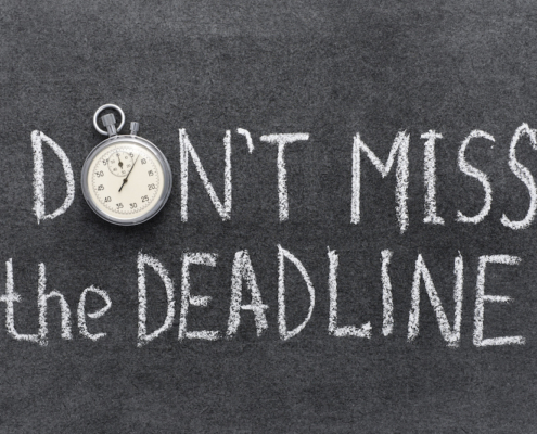 don’t miss the deadline concept handwritten on chalkboard with vintage precise stopwatch used instead of O