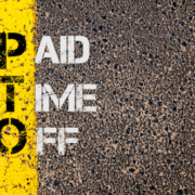 Business Acronym PTO - Paid Time Off. Yellow paint line on the road against asphalt background. Conceptual image