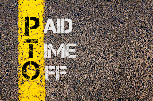 Business Acronym PTO - Paid Time Off. Yellow paint line on the road against asphalt background. Conceptual image