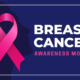 breast cancer awareness pink ribbon on a dark blue background