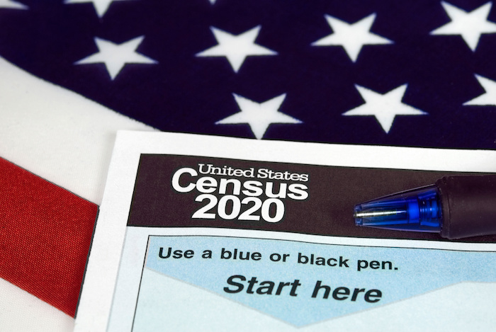 2020 census form on top of American flag click for more info