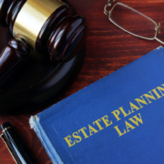 Book with title estate planning law and a gavel.