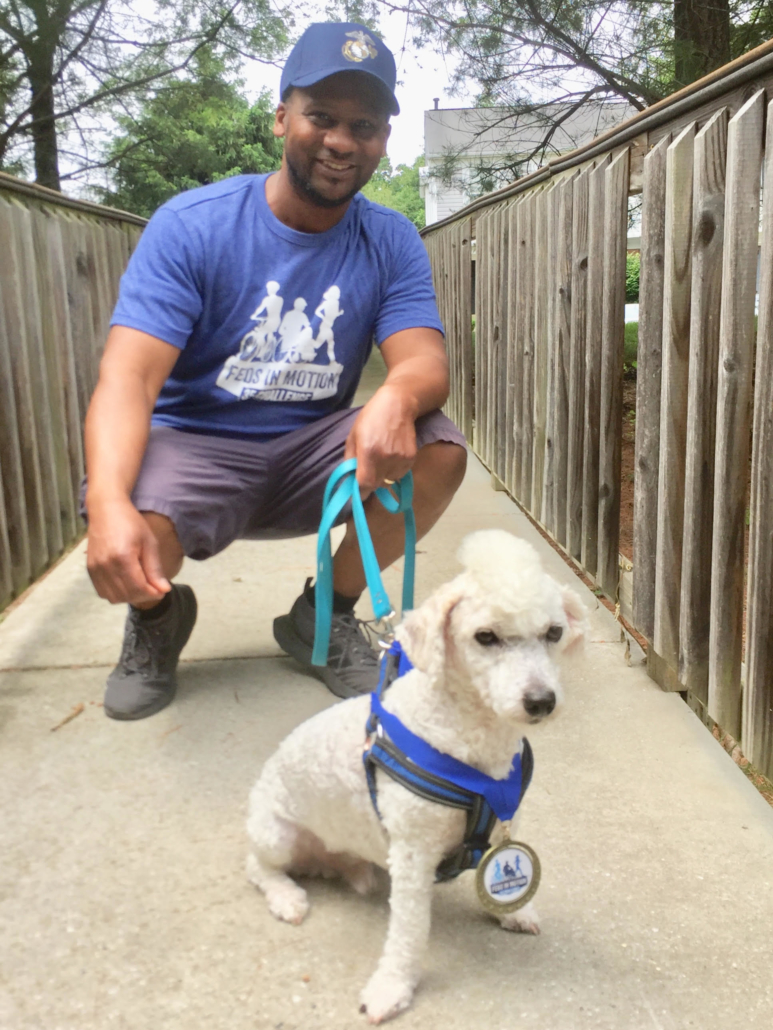 2021 participant Eric wearing his Challenge t-shirt and walking his small dog