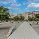 the Pentagon Memorial, looking down the path toward the building, with memorial benches off to each side
