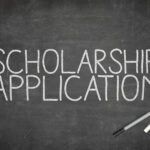 Scholarship application concept on blackboard with pen