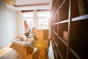 A woman packs items in her living room