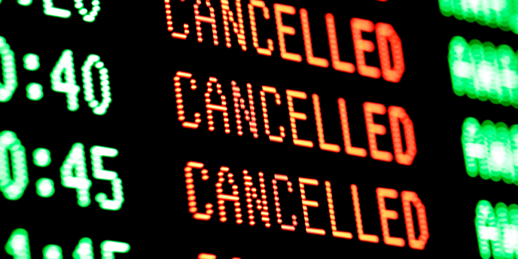 An image of a flight departure board at an airport showing cancelled flights. Flight delay or flight cancellation? That can be a frustrating experience. Here's our step-by-step guide to getting back on track. What To Do When Your Flight Gets Canceled