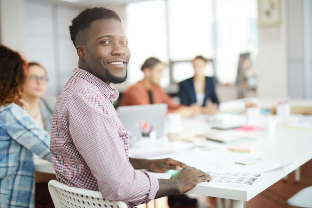 Young African Man Posing in office during one of his federal internships