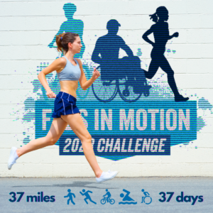 A woman runs by a wall with the Feds in Motion Challenge logo