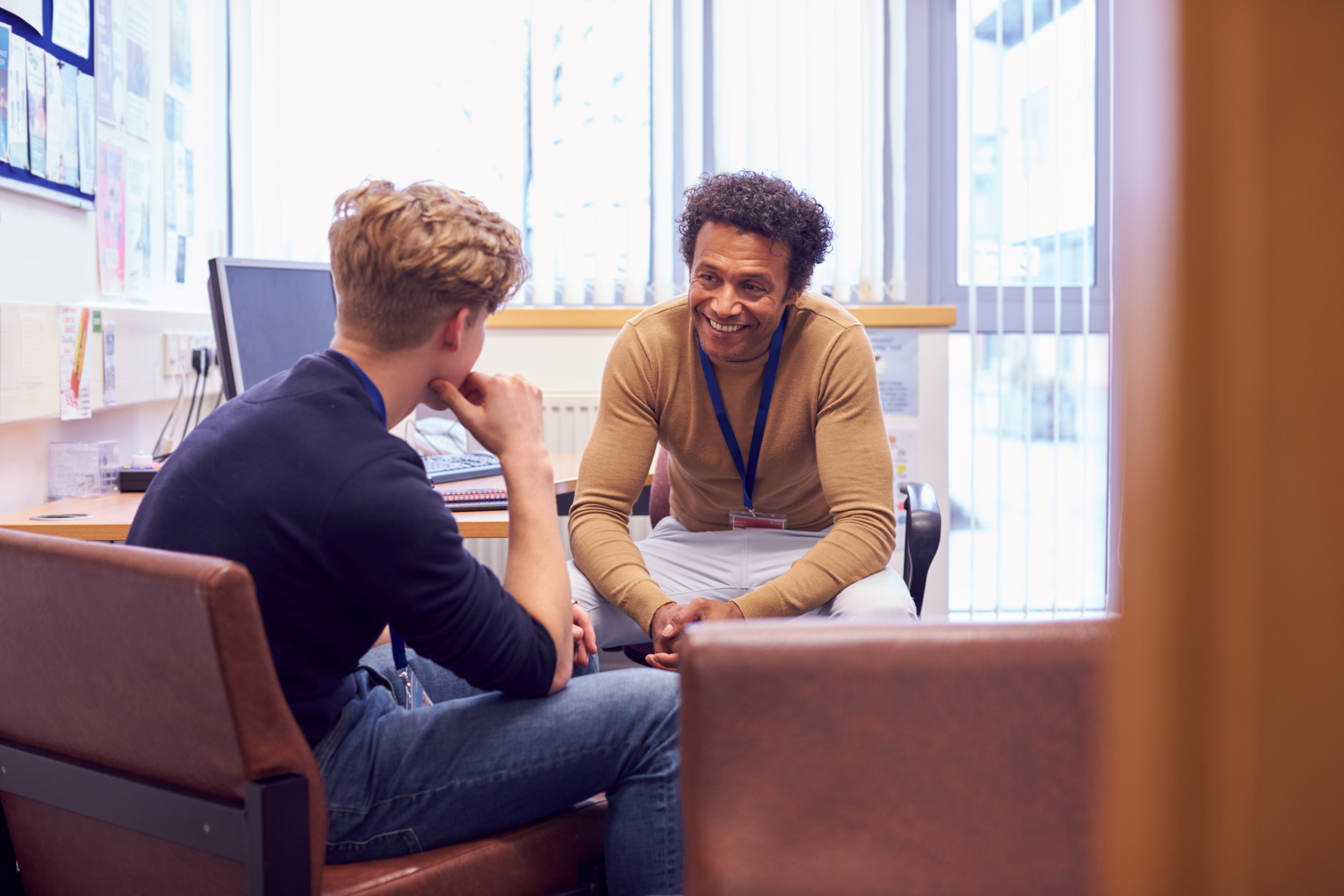 A man meets with a counselor. Being able to have open, healthy conversations about feelings and struggles is a key part of the mental health messaging during suicide prevention month.