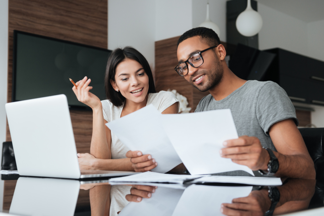 A couple reviews their finances as part of national financial awareness fay