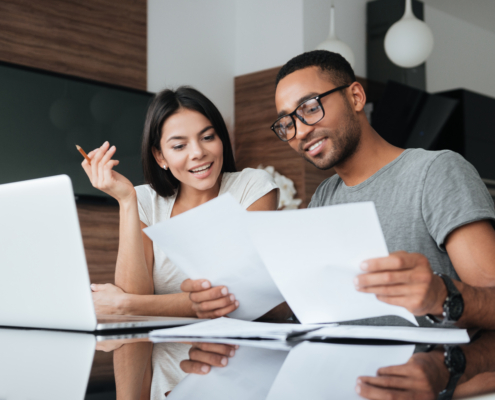 A couple reviews their finances as part of national financial awareness fay