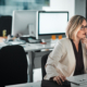 A woman works on her computer in the office. Having an email management plan can ensure an effective workflow efficiency